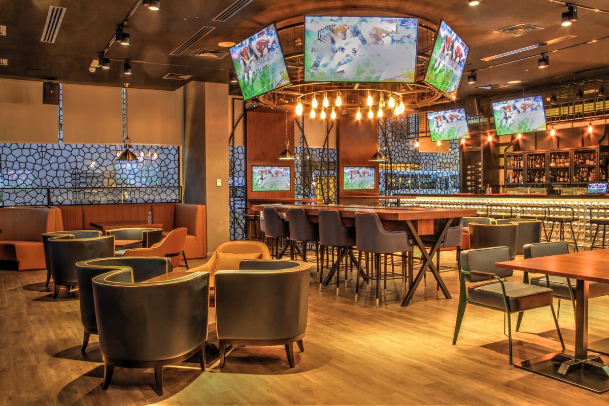 Restaurant sports bar with zoned speakers and a wall of TV screens