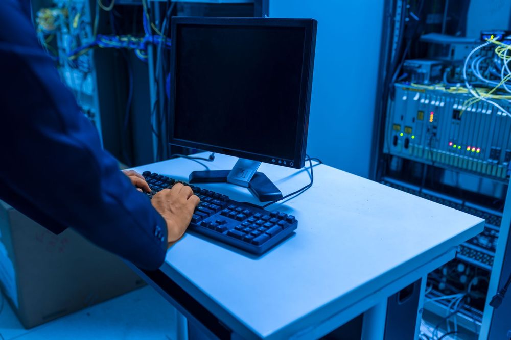 GTZ technician installing managed network equipment at a client site