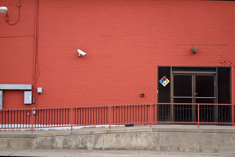 Surveillance security camera mounted on a commercial building exterior